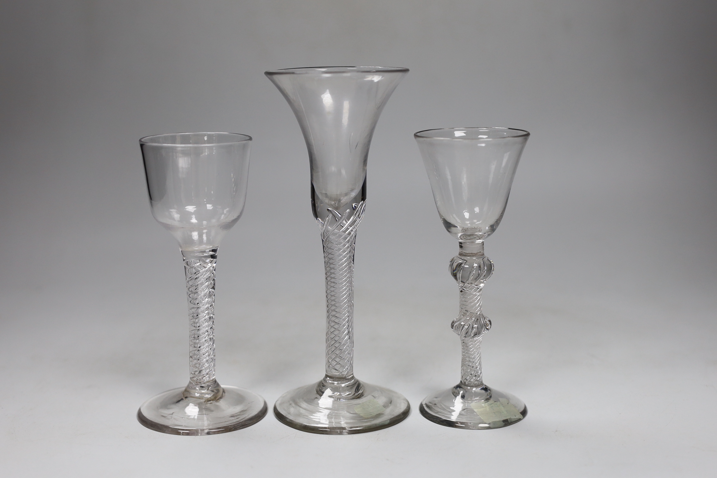 Three George II air twist stem wine or cordial glasses, tallest 17.5 cm high